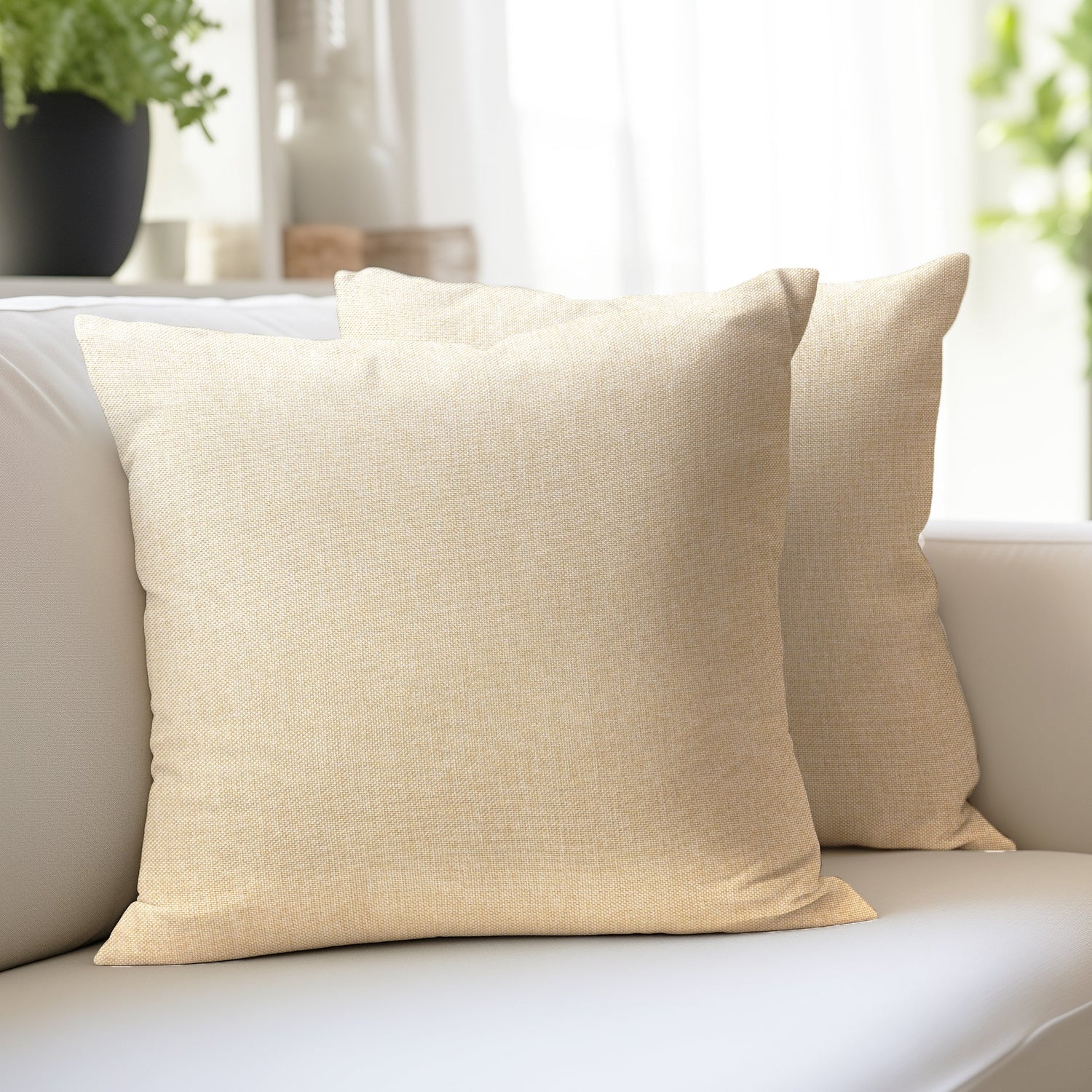 Jute Cherry cream cushion covers in a natural woven texture on a neutral sofa