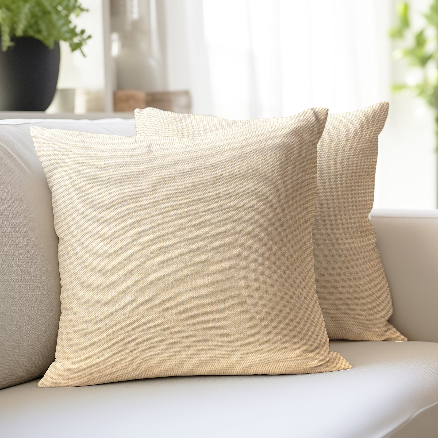 Jute Cherry cream cushion covers in a natural woven texture on a neutral sofa